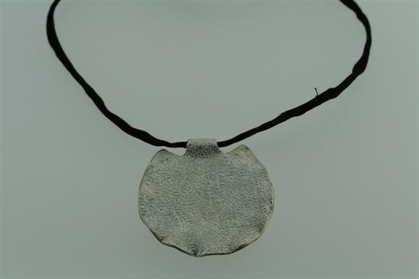 shield pendant on black silk thread necklace