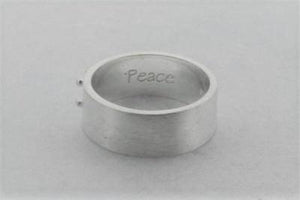silver braille ring spelling peace
