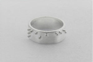 silver braille ring spelling peace