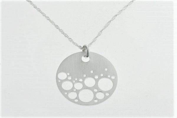 sterling silver circle pendant with bubble cutout detail on silver chain