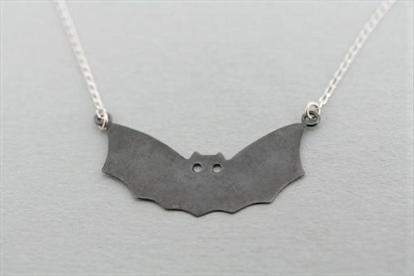 sterling silver bat necklace with an oxidized treatment