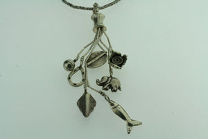 7 charm pendant on 75cm chain - Makers & Providers