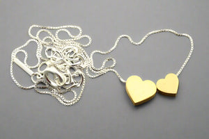 Double heart necklace - sterling silver with a 22 Kt gold finish - Makers & Providers