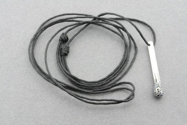 Burnt match on string necklace - Makers & Providers